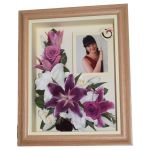 Remembrances picture of pink and white lilies with photograph detail in an oak box frame