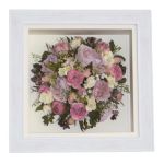 Pink round bridal posy of preserved roses and peonies displayed in a white box frame